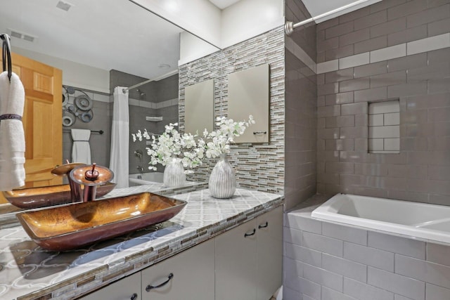 bathroom with vanity, tasteful backsplash, and shower / bathtub combination with curtain