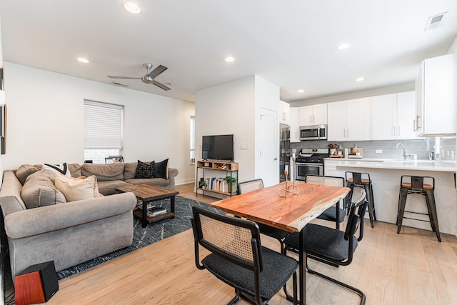 dining area featuring ceiling fan, recessed lighting, visible vents, and light wood-style floors