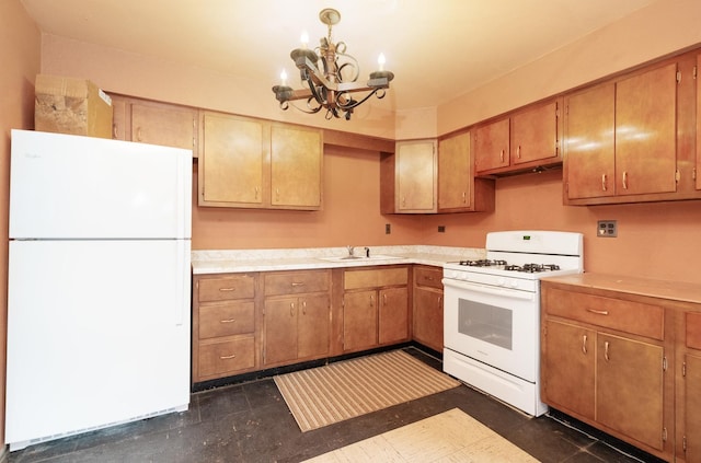 kitchen featuring sink, white appliances, and a notable chandelier