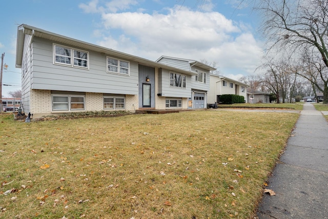 raised ranch with a front lawn