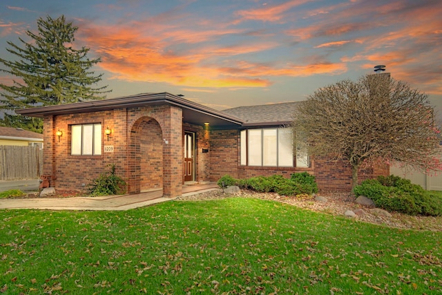 view of front of home with a yard