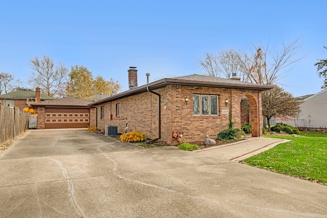 view of home's exterior featuring central AC and a garage