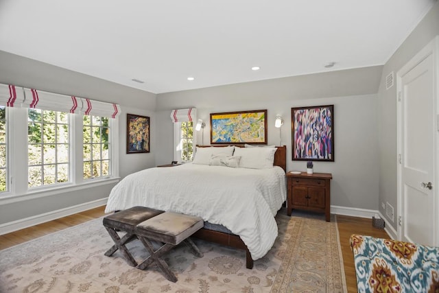 bedroom with wood-type flooring