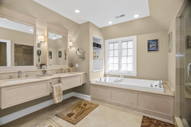 bathroom with tile patterned flooring, vanity, vaulted ceiling, and separate shower and tub