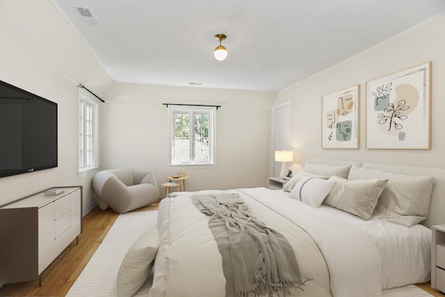 bedroom with light hardwood / wood-style floors