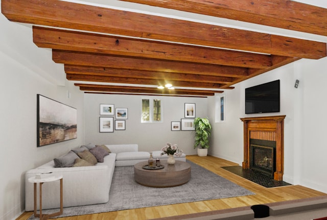 living room featuring hardwood / wood-style floors and beamed ceiling