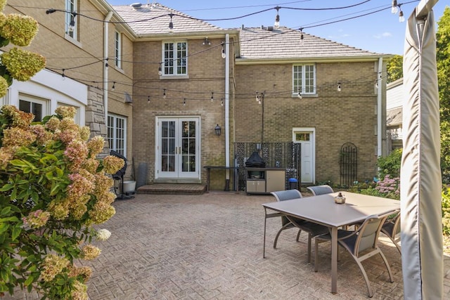 back of house featuring french doors and a patio area