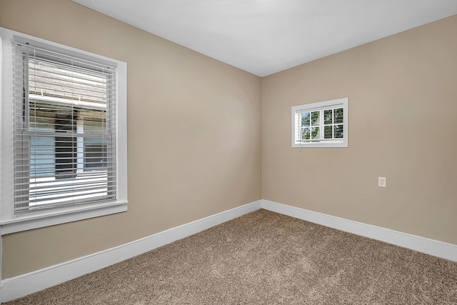 empty room with carpet flooring