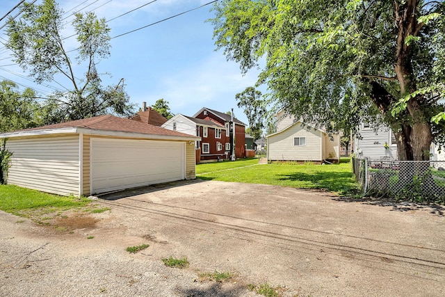 garage with a yard