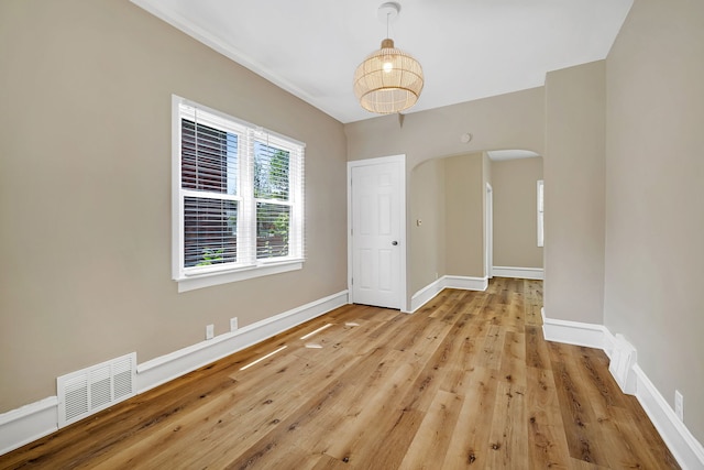 spare room featuring light hardwood / wood-style floors