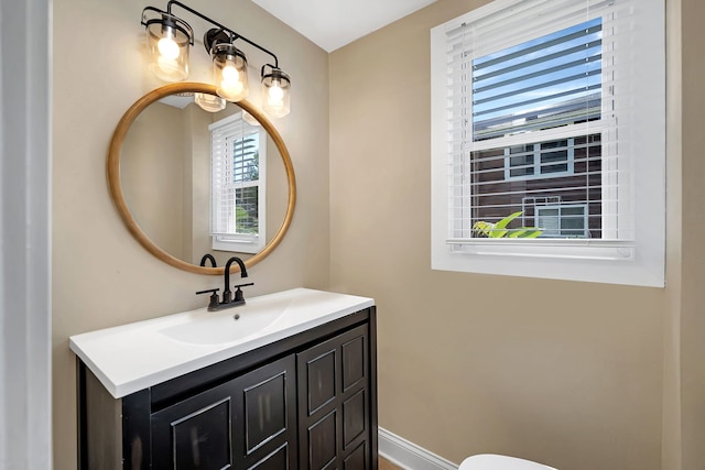 bathroom with vanity and a healthy amount of sunlight