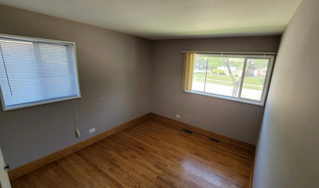 unfurnished room featuring wood-type flooring