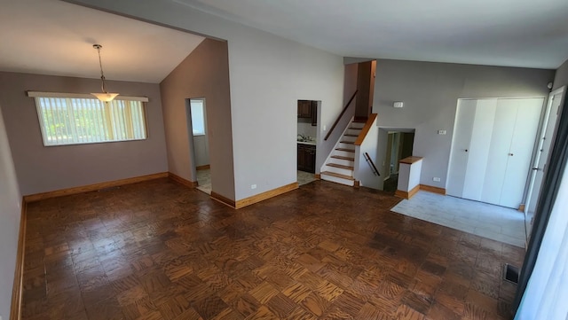 spare room with sink and vaulted ceiling