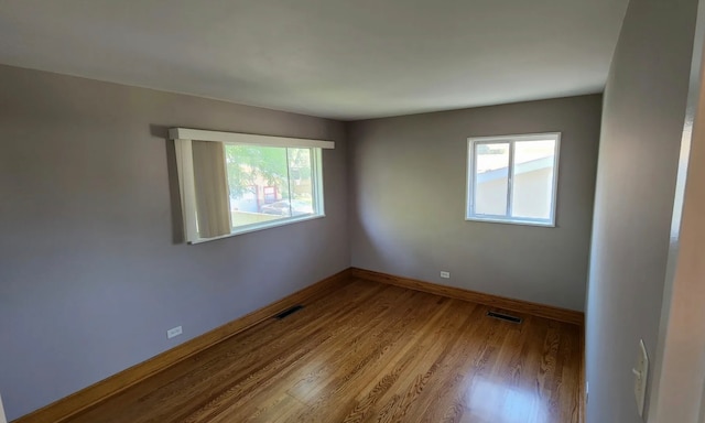 unfurnished room featuring light hardwood / wood-style flooring