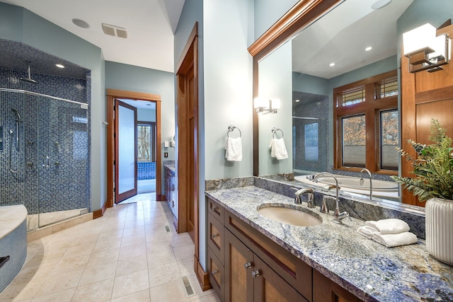 bathroom with tile patterned flooring, an enclosed shower, and vanity