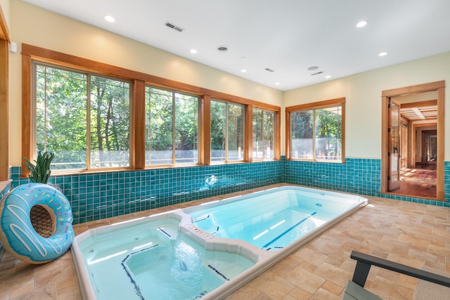 view of pool with an indoor in ground hot tub