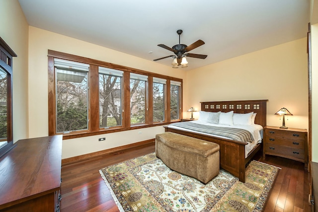 bedroom with dark wood-type flooring and ceiling fan