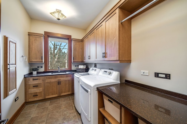 laundry area with independent washer and dryer, sink, and cabinets