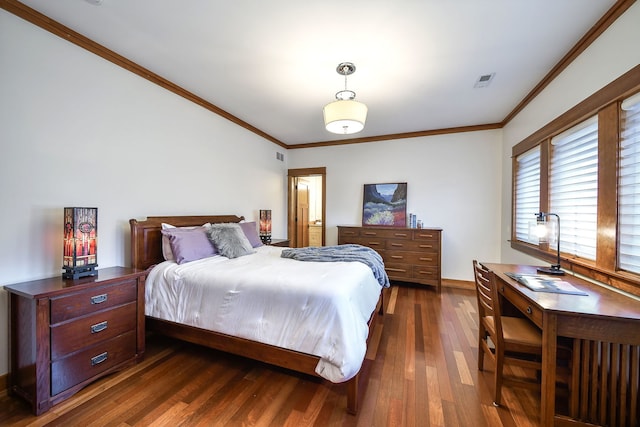 bedroom with crown molding and dark hardwood / wood-style floors