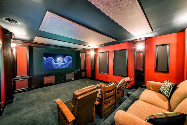 carpeted home theater room featuring ornate columns