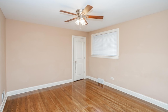 spare room featuring ceiling fan and light hardwood / wood-style flooring