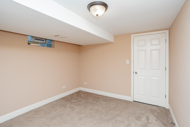 basement featuring light carpet