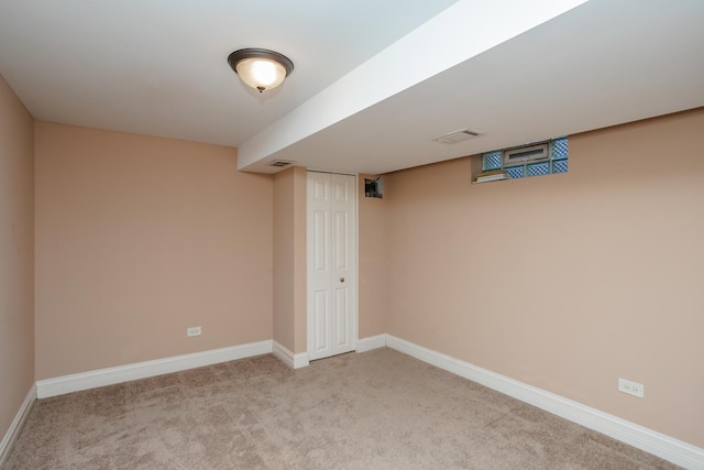 basement with light colored carpet