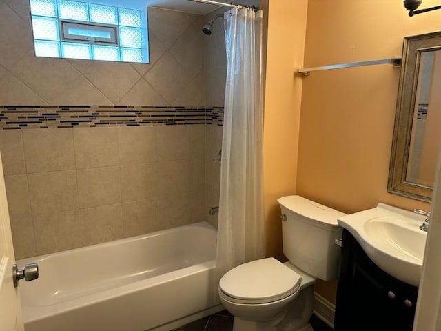 full bathroom featuring tile patterned floors, vanity, toilet, and shower / tub combo with curtain