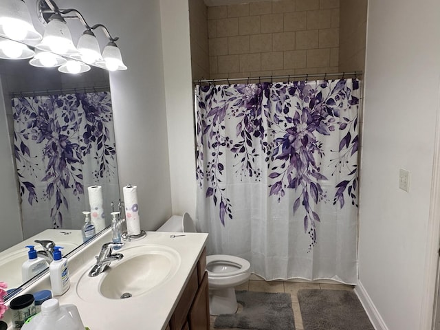 bathroom with toilet, vanity, tile patterned floors, and a shower with shower curtain