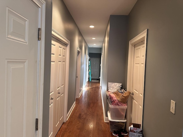 corridor with dark wood-type flooring