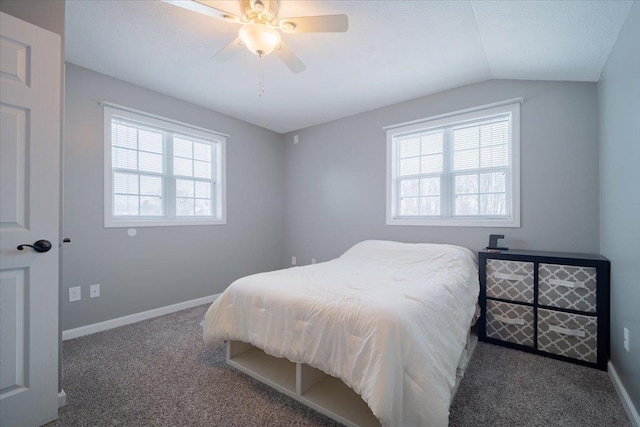 bedroom featuring vaulted ceiling, ceiling fan, and carpet