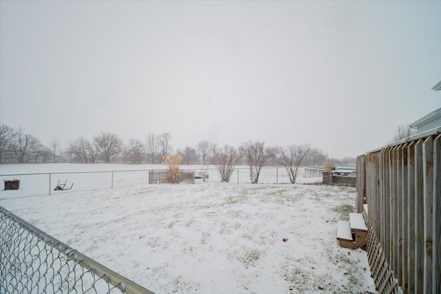 view of yard covered in snow