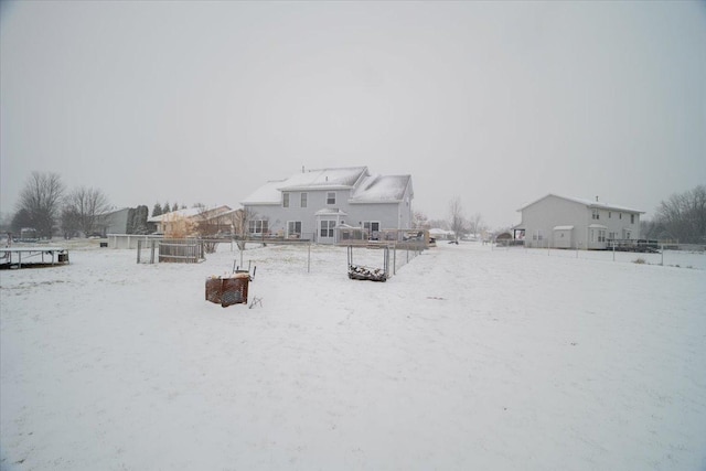 view of yard layered in snow