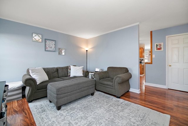 living room with hardwood / wood-style flooring and ornamental molding