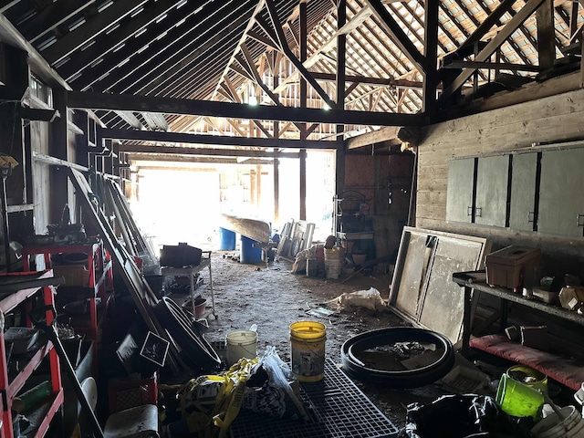 miscellaneous room featuring high vaulted ceiling