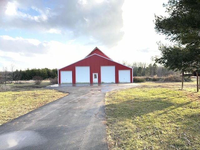 garage with a yard