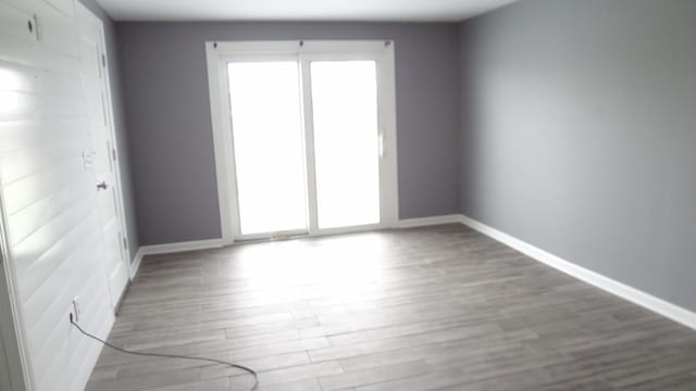 spare room featuring hardwood / wood-style floors