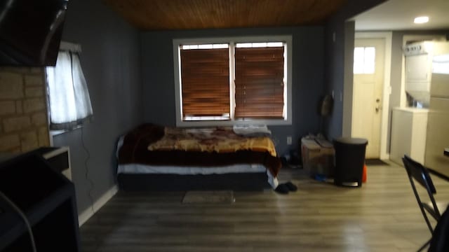 bedroom with wood-type flooring and wood ceiling