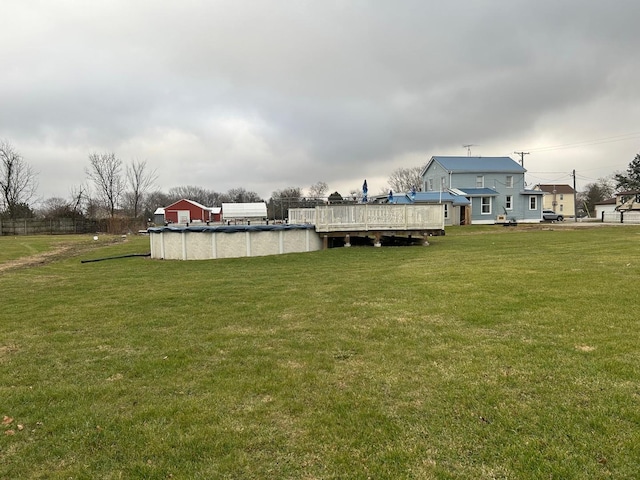 view of yard with a covered pool