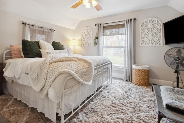 bedroom featuring ceiling fan, carpet, and lofted ceiling