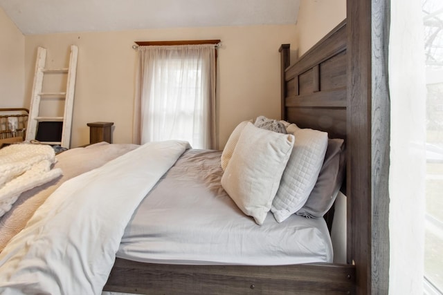 bedroom featuring vaulted ceiling