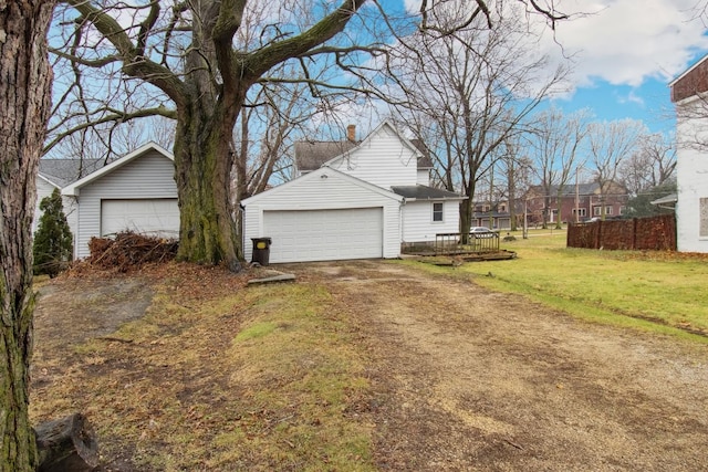 view of side of home featuring a lawn and a wooden deck