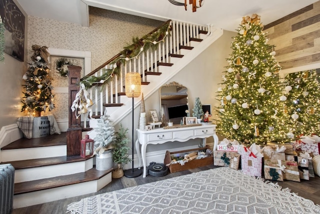 stairs featuring hardwood / wood-style floors