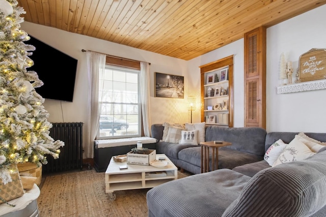 living room featuring wood-type flooring, radiator, and wooden ceiling