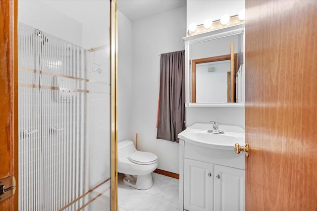 bathroom featuring a shower, tile patterned flooring, vanity, and toilet