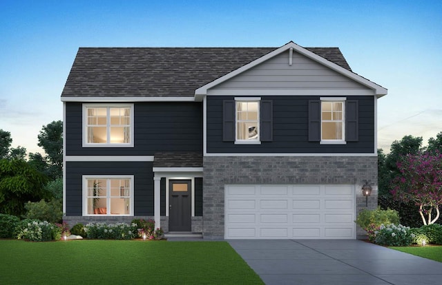 view of front of home featuring a garage and a front lawn