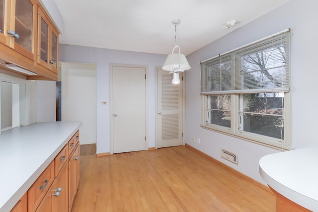 kitchen featuring pendant lighting and light wood-type flooring