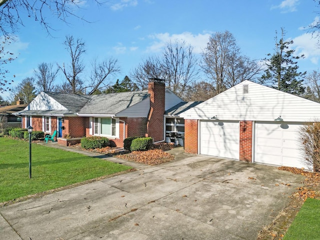 view of side of home featuring a garage and a lawn