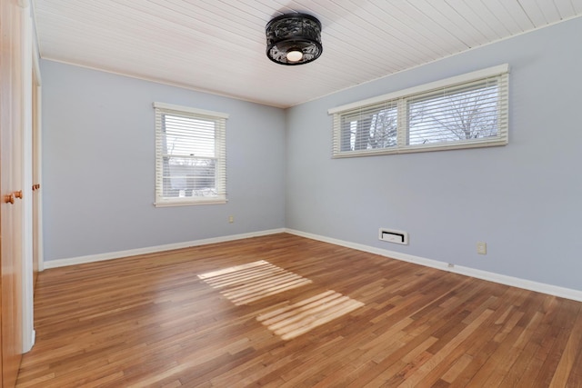 empty room with light hardwood / wood-style flooring