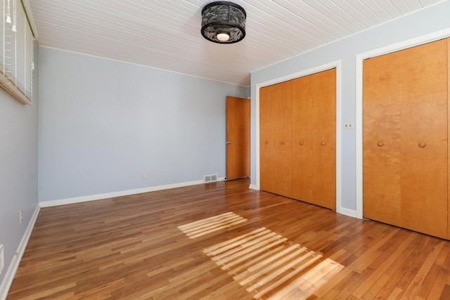 unfurnished bedroom featuring hardwood / wood-style floors